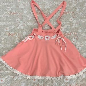 Pink lace trimmed romper.